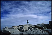 Hiker standing on flat rocks on top of Mt Whitney summit. California ( color)