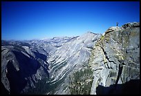 Hiker standing on top of Half-Dome, overlooking Tenaya Canyon. Yosemite National Park, California ( color)