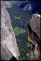 Climbers on Lost Arrow spire and Yosemite falls wall. Yosemite National Park, California