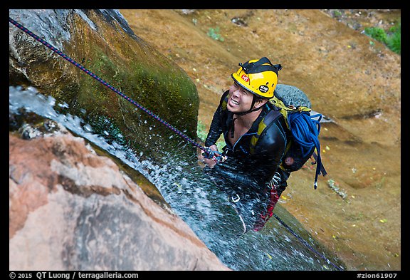 Canyoneer on rappel along waterfall. Zion National Park, Utah (color)
