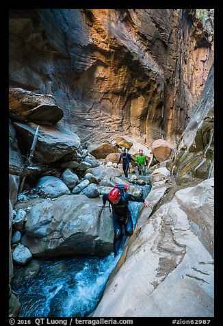 Canyoneers descend Orderville Canyon. Zion National Park (color)