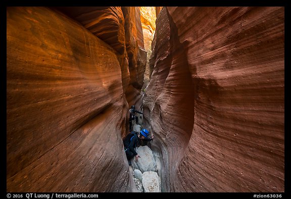 Canyoneers squeezing in Keyhole Canyon. Zion National Park (color)