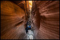 Canyoneers squeezing in Keyhole Canyon. Zion National Park, Utah ( color)