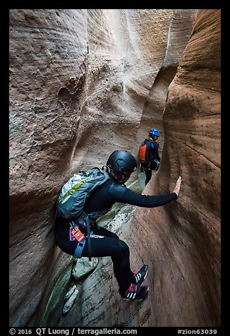 Canyoneer using chimney technique in narrow section of Keyhole Canyon. Zion National Park (color)