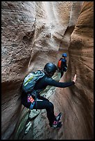 Canyoneer using chimney technique in narrow section of Keyhole Canyon. Zion National Park, Utah ( color)