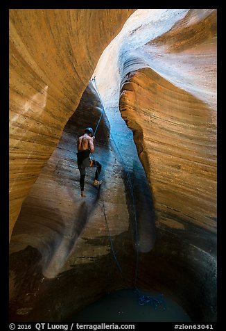 Canyoneer rappels into Keyhole Canyon. Zion National Park (color)