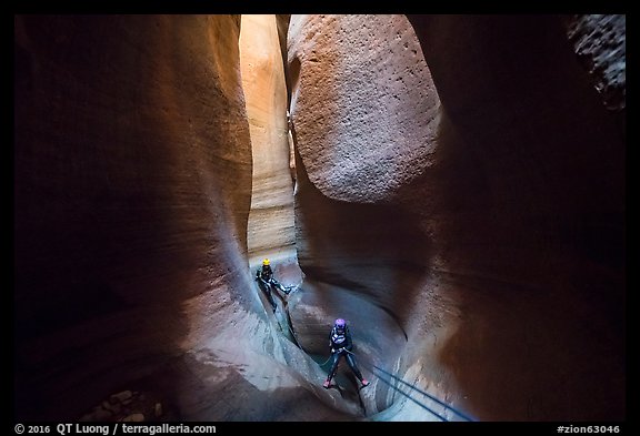 Canyoneers deep in subterranean part of Keyhole Canyon. Zion National Park (color)