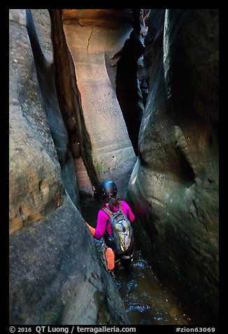 Canyoneer in tight squeeze, Das Boot Canyon. Zion National Park (color)