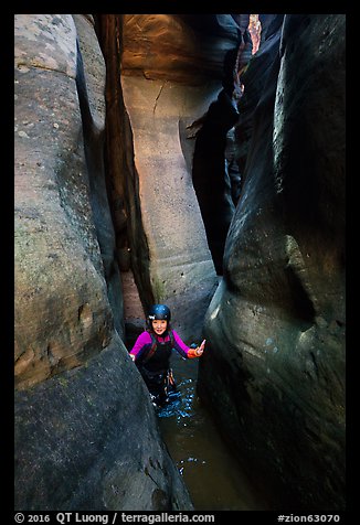 Canyoneer in tight and wet section of Das Boot Canyon. Zion National Park (color)