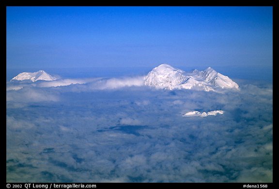 Mt Foraker and Mt Mc Kinley emerge from a sea of clouds. Denali National Park (color)