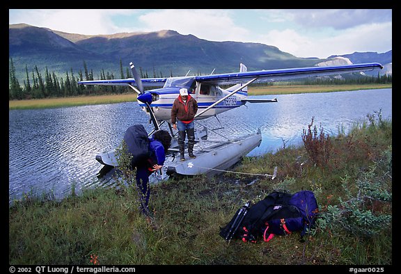 Backpackers beeing dropped off by a floatplane at Circle Lake. Gates of the Arctic National Park, Alaska (color)