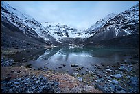 Partly frozen lake and Three River Mountain, dawn. Gates of the Arctic National Park ( color)