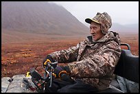 Nunamiut subsistence hunter driving Argo vehicle. Gates of the Arctic National Park ( color)