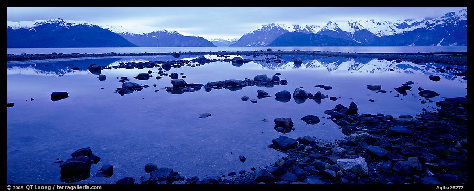 Blue scenery of water and mountains at dusk. Glacier Bay National Park, Alaska, USA.
