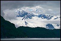 Dark ridge and cloud shrouded peaks, West Arm. Glacier Bay National Park, Alaska, USA.