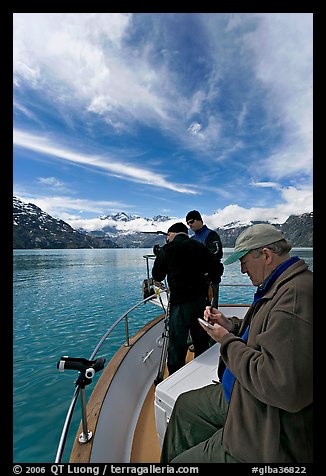 Movie producer taking notes as crew films. Glacier Bay National Park (color)