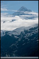 Pointed mountain with clouds hanging below. Glacier Bay National Park, Alaska, USA. (color)