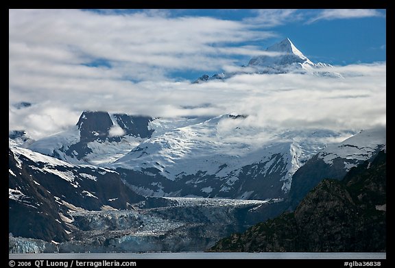Pointed peaks of Fairweather range emerging from clouds. Glacier Bay National Park, Alaska, USA.