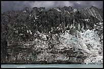 Ice colored by black moraining debris on the front of Margerie Glacier. Glacier Bay National Park, Alaska, USA. (color)