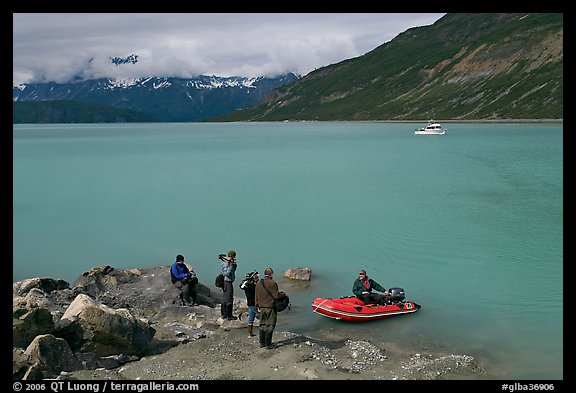 Film crew met by a skiff after shore excursion. Glacier Bay National Park (color)
