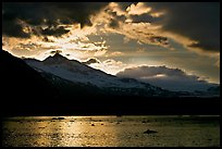 Mount Eliza and Tarr Inlet under clouds at sunset. Glacier Bay National Park, Alaska, USA.