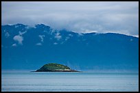 Green Island in blue seascape. Glacier Bay National Park, Alaska, USA. (color)