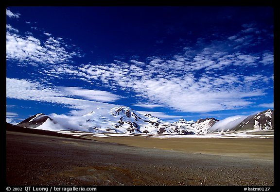 The desert-like floor of the Valley of Ten Thousand smokes is surrounded by snow-covered peaks such as Mt Meigeck. Katmai National Park