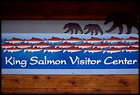 Bears and salmon on visitor center sign. Katmai National Park, Alaska, USA. (color)