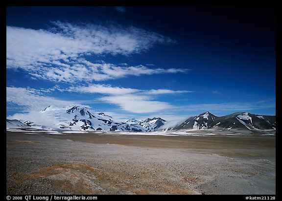 The desert-like floor of the Valley of Ten Thousand smokes is surrounded by snow-covered peaks such as Mt Meigeck. Katmai National Park (color)