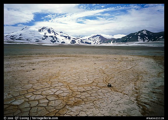 The desert-like floor of the Valley of Ten Thousand smokes is surrounded by snow-covered peaks such as Mt Meigeck. Katmai National Park, Alaska, USA.