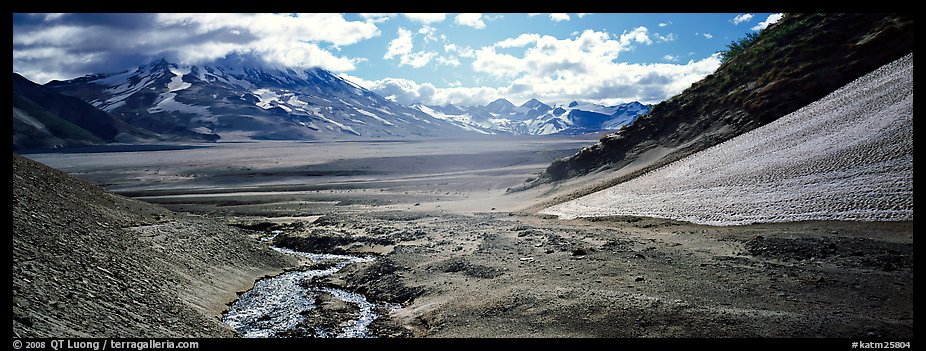 Stream flowing into arid ash-covered valley. Katmai National Park (color)