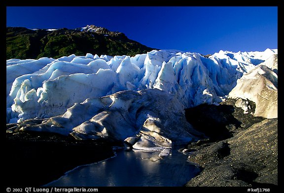Frozen glacial pond and front of Exit Glacier, early morning. Kenai Fjords National Park (color)
