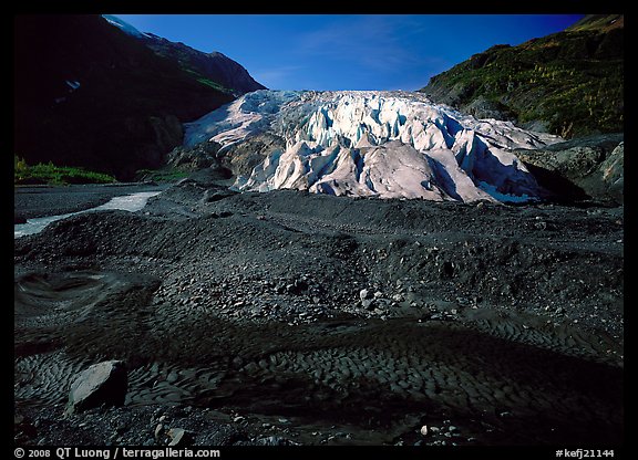 Dark glacial plain floor and Exit Glacier. Kenai Fjords National Park, Alaska, USA.