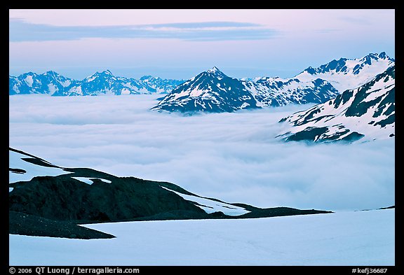 Mountains above low fog at dusk. Kenai Fjords National Park, Alaska, USA.