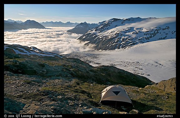 Camping in tent above glacier and sea of clouds. Kenai Fjords National Park, Alaska, USA.