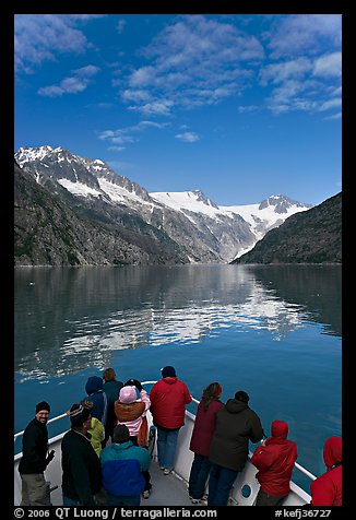 Mountains reflected in fjord, seen by tour boat passengers, Northwestern Fjord. Kenai Fjords National Park (color)