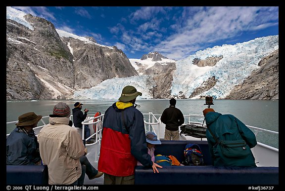 Passengers on the deck of tour boat and Northwestern glacier, Northwestern Lagoon. Kenai Fjords National Park, Alaska, USA.