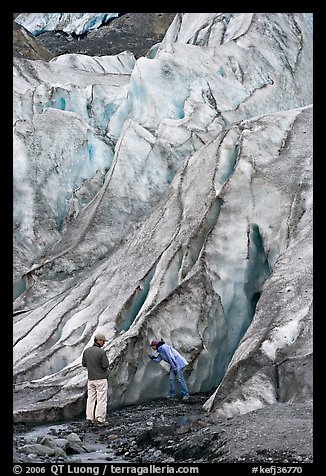 Couple checking out the ice at the terminus of Exit Glacier. Kenai Fjords National Park, Alaska, USA.