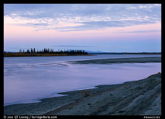 Low sandy shore of Kobuk River at dusk. Kobuk Valley National Park, Alaska, USA.