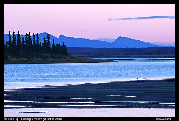 Sand bar shore, river and Baird mountains, evening. Kobuk Valley National Park, Alaska, USA.