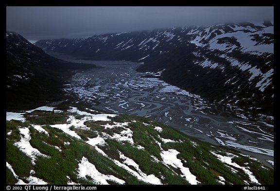 Aerial view of Tikakila River valley under dark clouds. Lake Clark National Park, Alaska, USA.