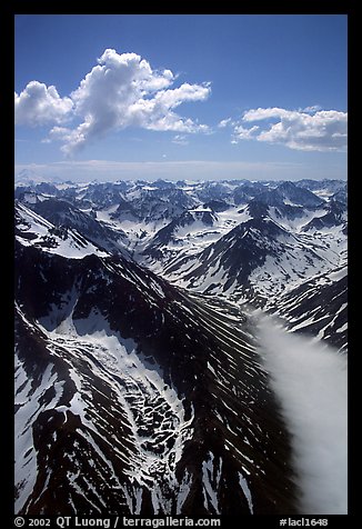 Aerial view of rocky peaks with snow, Chigmit Mountains. Lake Clark National Park, Alaska, USA.