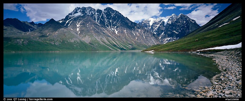 Tall mountains reflected in Turquoise Lake. Lake Clark National Park, Alaska, USA.