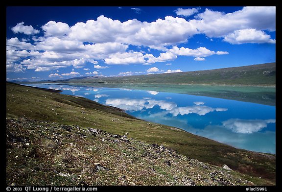 Turquoise Lake and clouds. Lake Clark National Park, Alaska, USA.