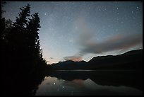 Starry sky above Kontrashibuna Lake. Lake Clark National Park, Alaska, USA.