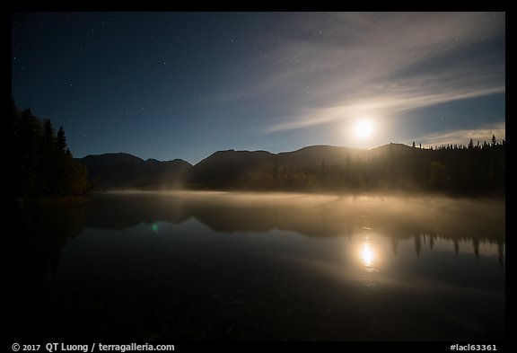 Kontrashibuna Lake and moon at night. Lake Clark National Park, Alaska, USA.