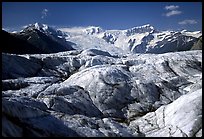 Crevasses on Root glacier, Wrangell mountains in the background. Wrangell-St Elias National Park, Alaska, USA. (color)