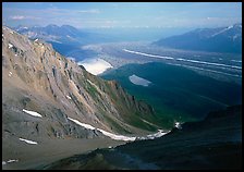 View over hazy Chugach mountains and Kennicott Glacier from Mt Donoho. Wrangell-St Elias National Park, Alaska, USA.