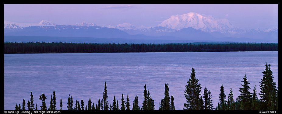 Snowy mountain rising mysteriously above lake. Wrangell-St Elias National Park, Alaska, USA.
