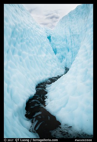 Glacial stream between steep walls of ice, Root Glacier. Wrangell-St Elias National Park (color)